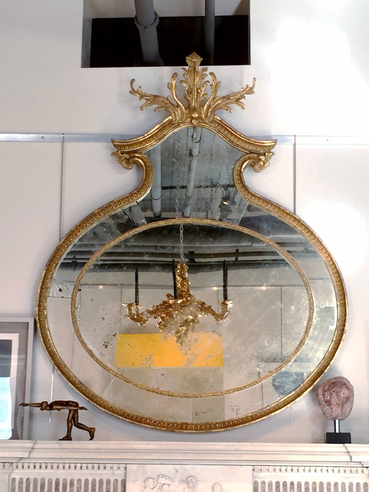 Unusual Adam Oval Giltwood Mirror
English, circa 1775