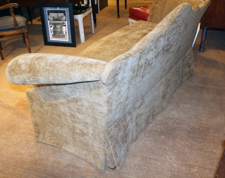 Chippendale Mahogany Camel Back Sofa recently reupholstered in tan chenille.