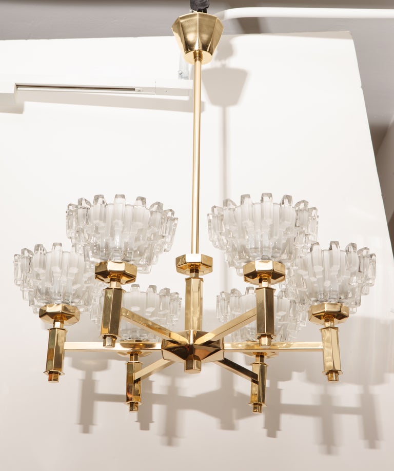 Exceptional Scandinavian Modern brass frame chandeliers with six frosted and polished crystal cups designed by Hans-Agne Jakobsson. Only 1 available