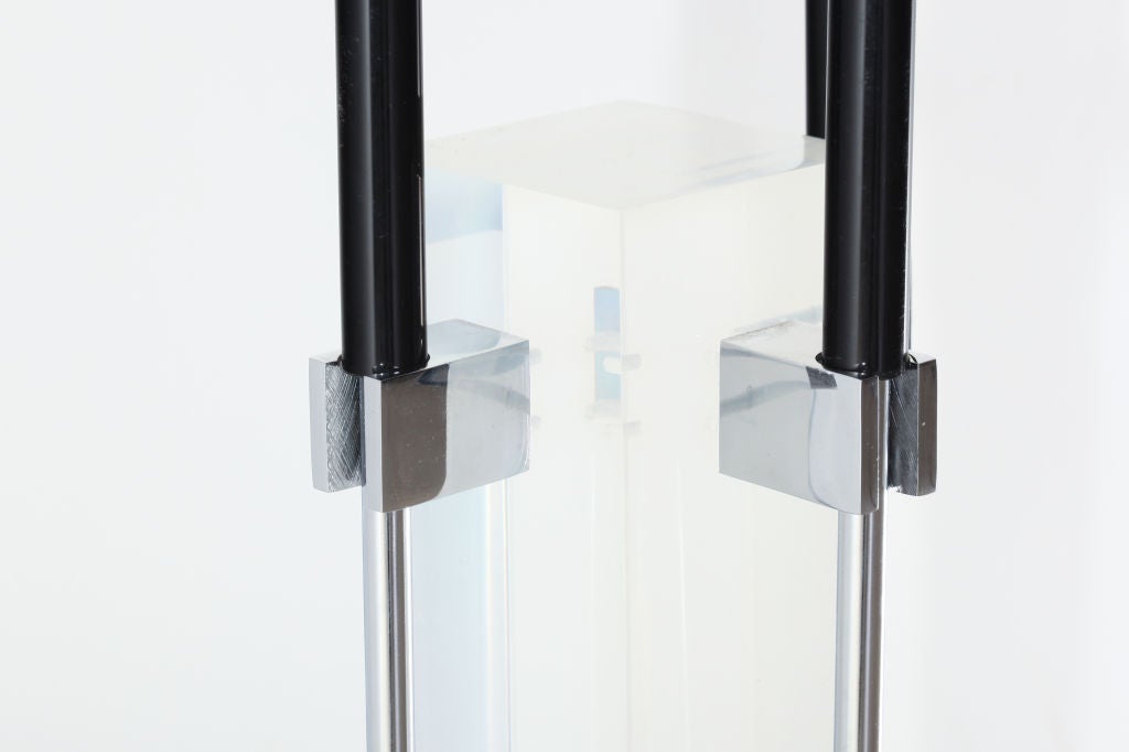 Exceptional set of chromed fireplace tools attached to a Lucite column with heat resistant resin handles.