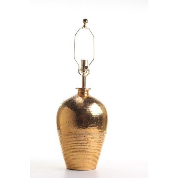 Exceptional large pair of 22kt gold glazed ribbed ceramic lamps with brass hardware.