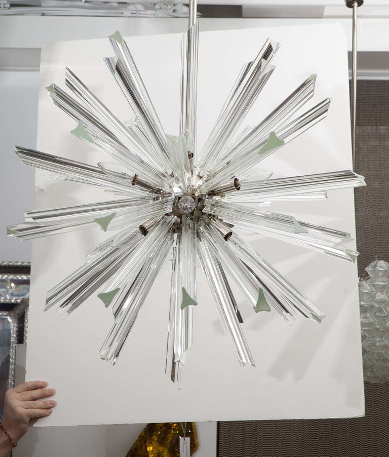 Exceptional crystal sputnik chandelier suspended from a polished nickel stem.