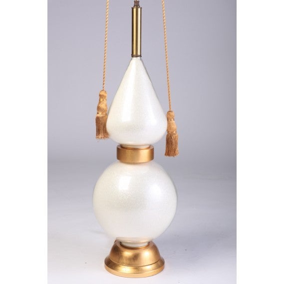 Exceptional large-scale pearl white Murano glass lamp on gilded wood base and double tassel pull sockets.