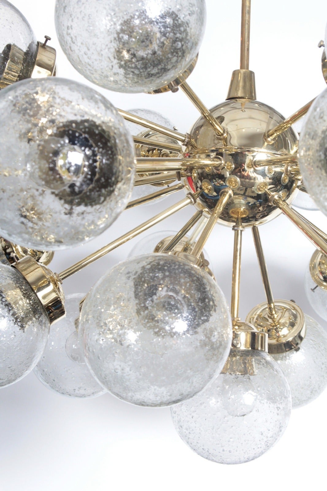 Amazing large-scale brass Sputnik chandelier with 25 glass globes by Doria. Stem can be cut to size. Chandelier body measures 21.5 inches tall.