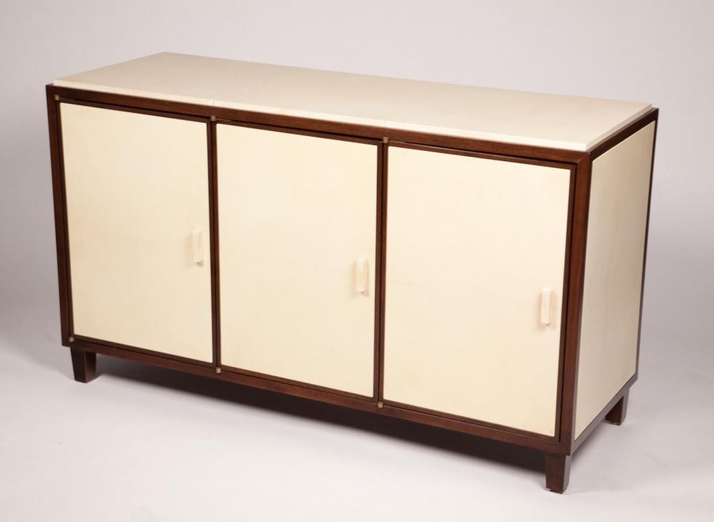 Exceptional 3 door Walnut credenza with parchment paneled top, sides and front each compartment with one adjustable Walnut shelf.<br />
Visit Quotientnyc.com to view our complete collection.