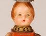 Fantastic doll TOTEM sculpture composed of European doll parts, European and American vintage tin tea caddies, fire bell, and topped by a whimsical tin bird. Signed by the artist.