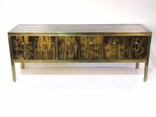 Exceptional six-panel acid etched brass credenza with brass pulls housed in a brass frame. Designed by Bernhard Rohne for Mastercraft.
