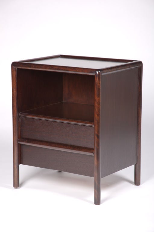 Exceptional pair of Dark Walnut nightstands with a bottom drawer and rounded legs and frame.