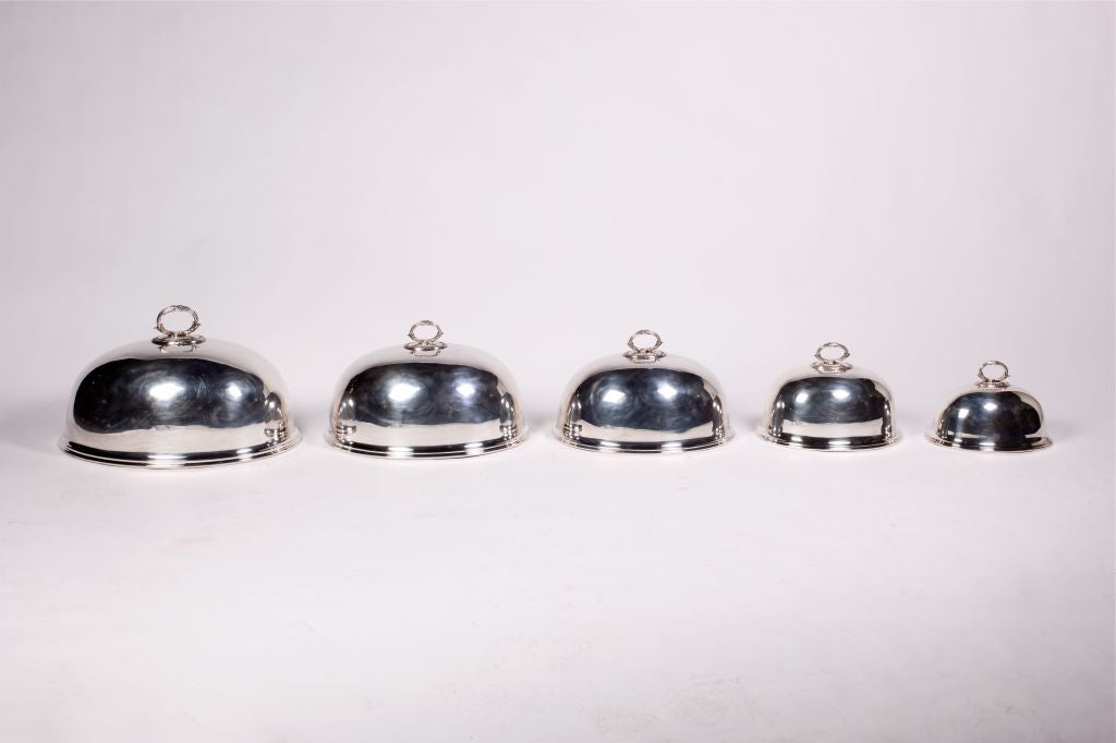 A spectacular set of 5 matched silverplate food covers by England's famed Mappin & Webb. Perfect to dress up any table, or to use as a centerpiece. Each dome is stamped with the Triple Deposit Mappin & Webb's Prince's Plate London as well as the