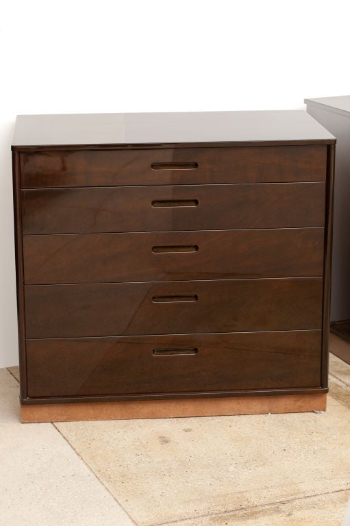 Exceptional ebonized mahogany chest of drawers with leather wrapped base designed by Edward Wormley for Dunbar. Chest has a flip down top drawer featuring compartments and can be used as a writing surface.