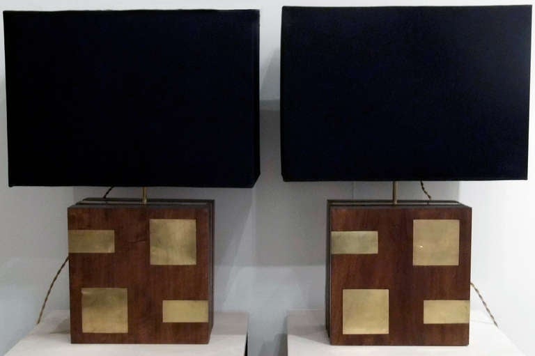 Pair of lamps with rectangular walnut and brass base. Elegant design with beautifully crafted details. Rewired for american market. Black fabric shades.