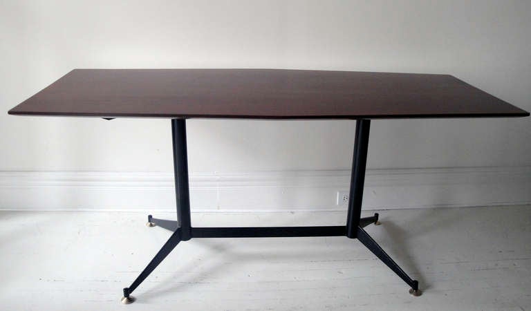 Rare table by Osvaldo Borsani. Black laquered frame with brass feet, rosewood top. Excellent restored condition.