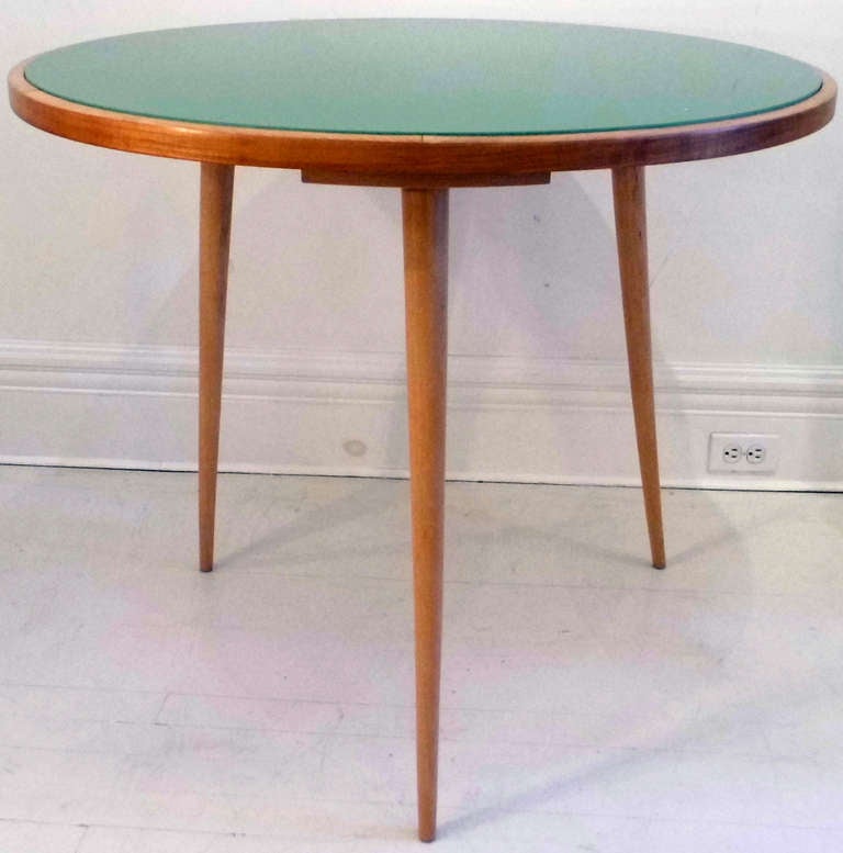 Italian round dining / center table from 50's. Walnut base with rare solid green glass top.