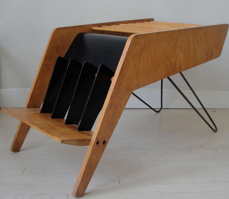 An exceptional constructivist magazine rack. Birch plywood frame with brass hairpin legs and black lacquered dividers. Excellent for vintage vinyl records and magazines.