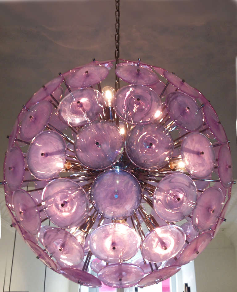 Spectacular iridescent lilac glass chandelier. Chrome structure with 95 round glass disks and 12 light sockets. Diameter of each disk: 6
