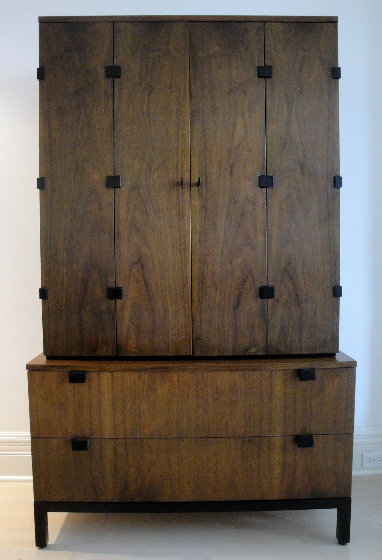 Kipp Stewart's walnut cabinet designed for Directional.
Bottom part consists of two drawers. The top part, a cabinet has detailed shelving and two small drawers.
