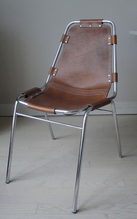 Four chromium plated tubular steel chairs <br />
with leather upholstery, designed and made <br />
for the Amenagment de la Station des Arcs 1800.<br />
Literature: Charlotte Perriand, Un Art de Vivre, <br />
Musée des Arts Decoratives, Paris,