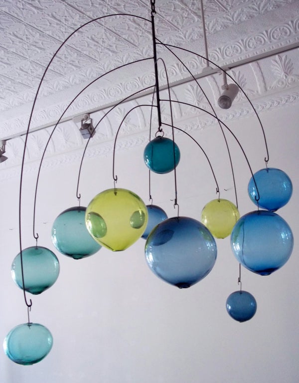 Spectacular hanging mobile sculpture with hand blown glass in three colors.
