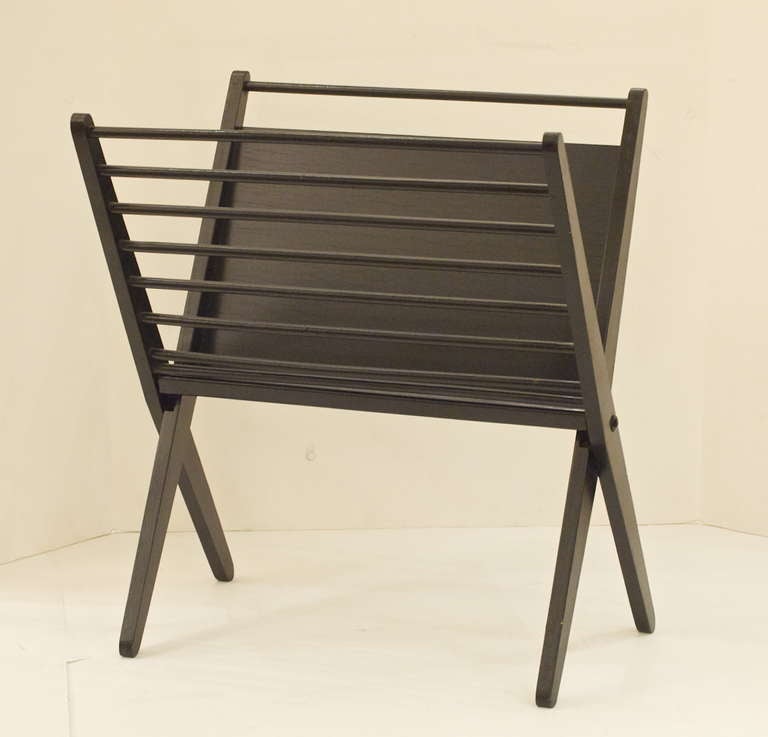 Quintessential mid century form to this folding magazine rack. Great addition to suit a variety of styles.