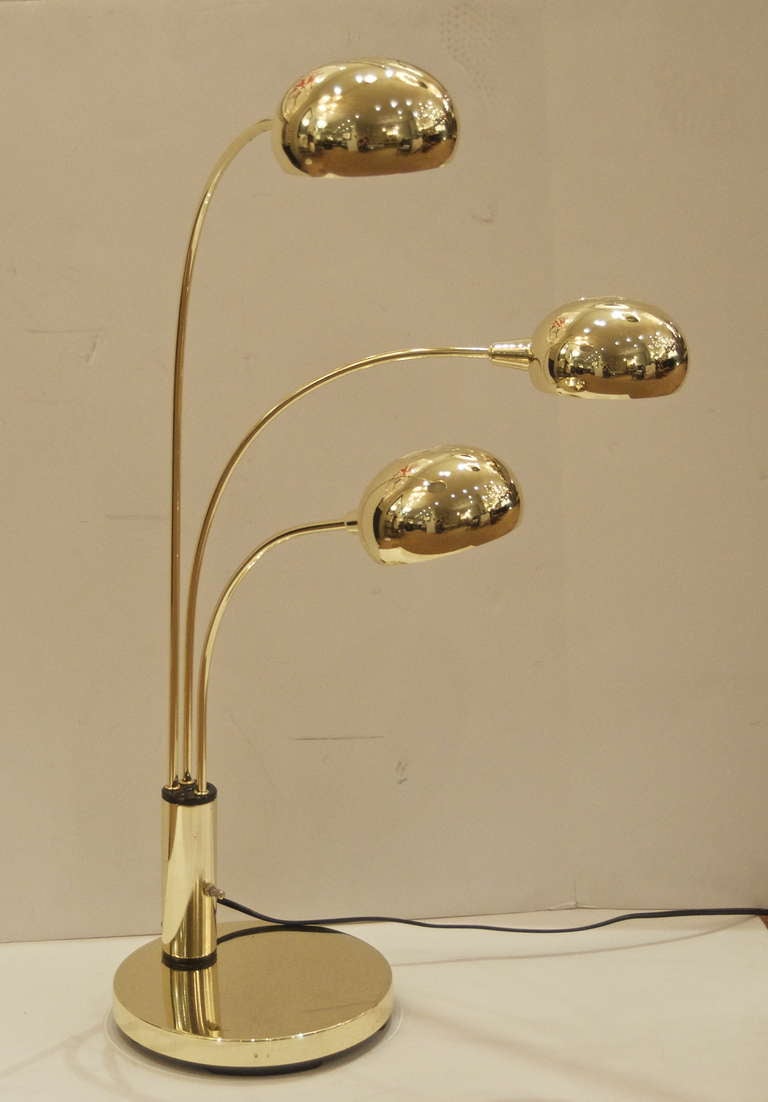 Pair of 20th century arc form table lamps. Arms swivel laterally. Well formed and substantial.