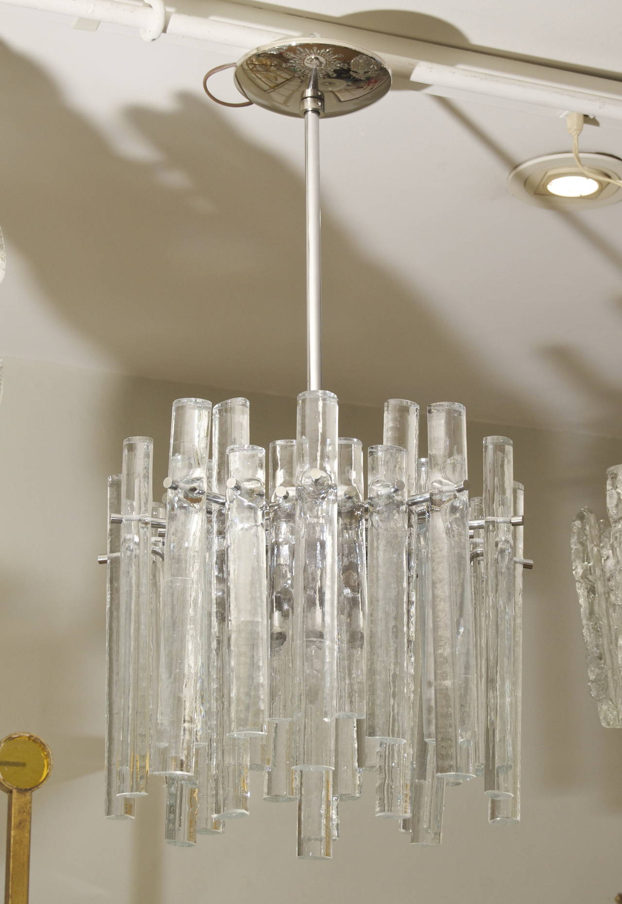 This elegant stream lined ice crystal fixture will complement all decors.

Three E-14 base bulbs radiate from body, up to 40 watts per bulb, and one medium base downlight bulb, up to 75 watts. New wiring. 

Height is of light fixture only.