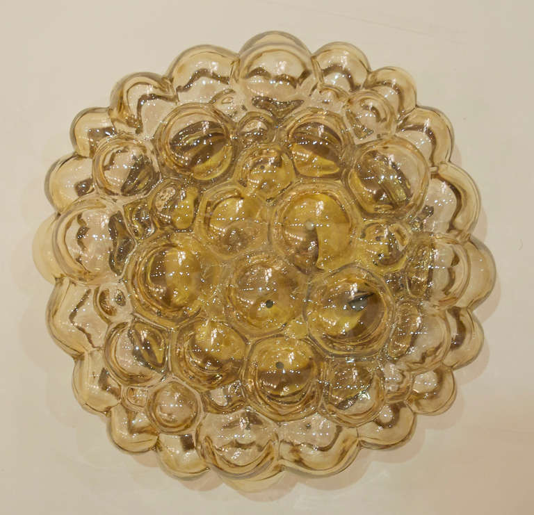 Amber bubble glass flush mount light adds a fantastic look to all decors.

Takes a single medium base bulb up to 60 watts. New wiring. Pictured with 15 watt bulb.

Price is for pair.