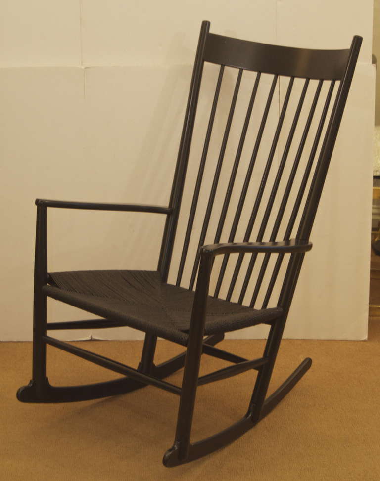 Hans Wegner rocking chair in ebonized wood.