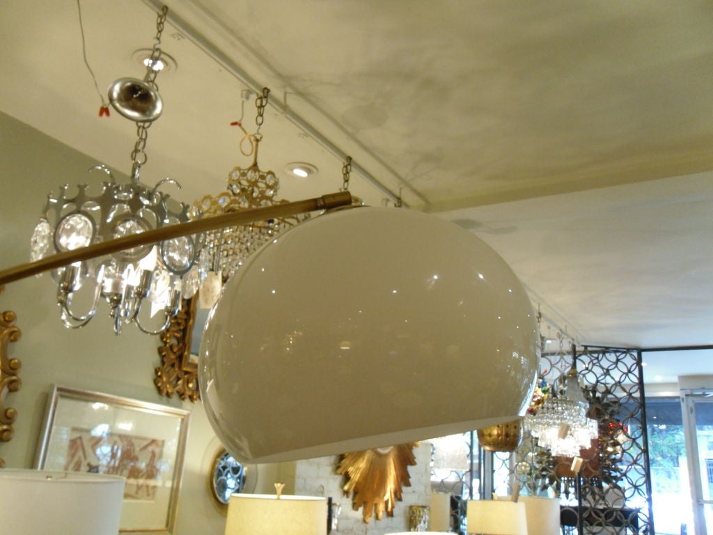 Large Arc Lamp has marble base, brass hardware, and a white globe shade. Light tilts up or as seen.