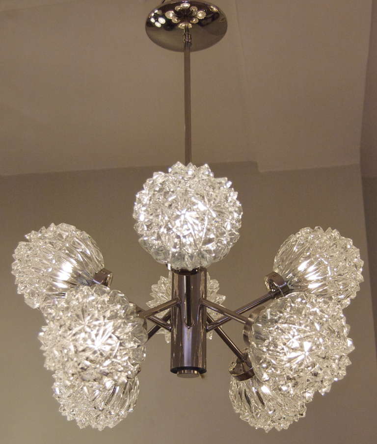 Fantastic sculptural sputnik chandelier by Richard Essig, with eight cut crystalline pattern globes. Completely rewired, each arm takes a single E-14 base bulb up to 40 watts per bulb. Height listed is as currently hung; height of chandelier body