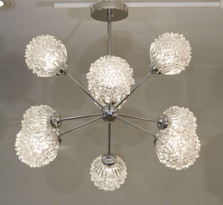 Sculptural sputnik chandelier. An amazing addition to all decors. Nickel and cut glass makes this a stand out piece. An early form Richard Essig chandelier with an unusual crystalline globe structure.

Takes 9 E-14 base bulbs up to 40 watts per