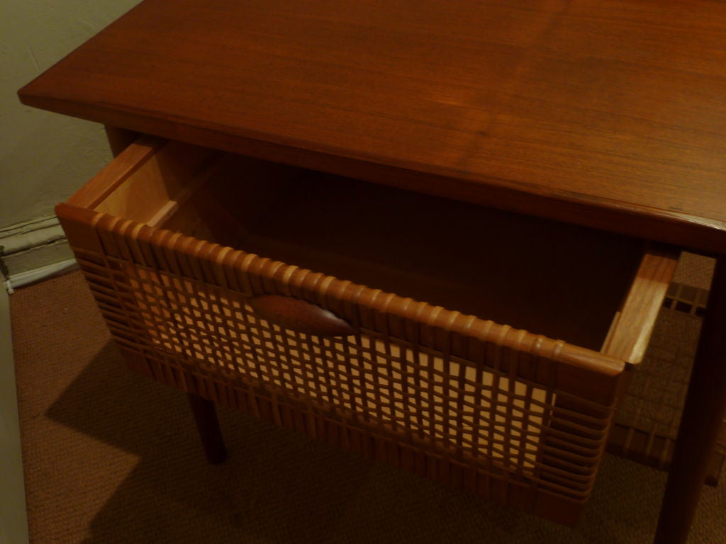This beautifully crafted mid-century danish table with double sided drawer and lower shelf would make a versatile addition to any space.