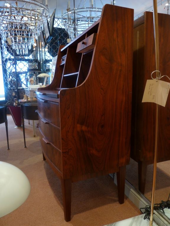 This beautiful rosewood Danish mid-century secretary would make a great multifunctional piece with enough storage to work as a dresser plus pull out desk space and display shelves.