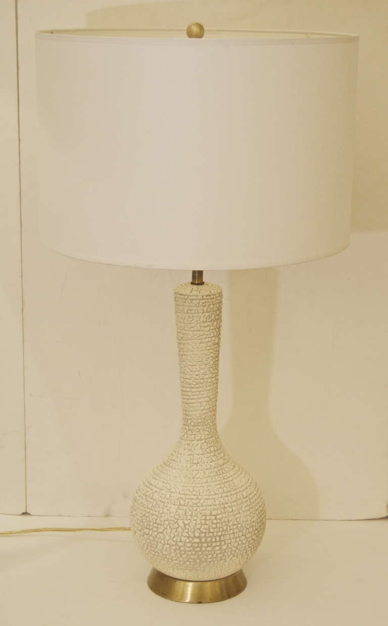 Excellently formed ceramic table lamp with a heavily textured surface.

New wiring and socket. Height listed is with 11
