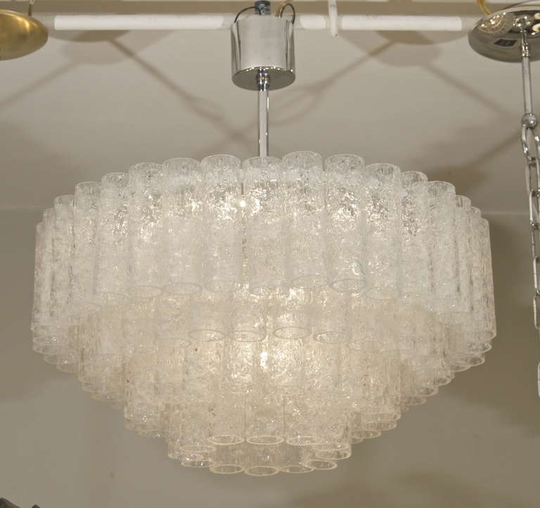 This exceptional chandelier by Doria has four tiers bearing 96 separate tubes of glass. Takes ten E-14 bulbs, six radiating at the top tier, with four downlighting at center of chandelier. Each up to 40W each.
Height listed is of chandelier body
