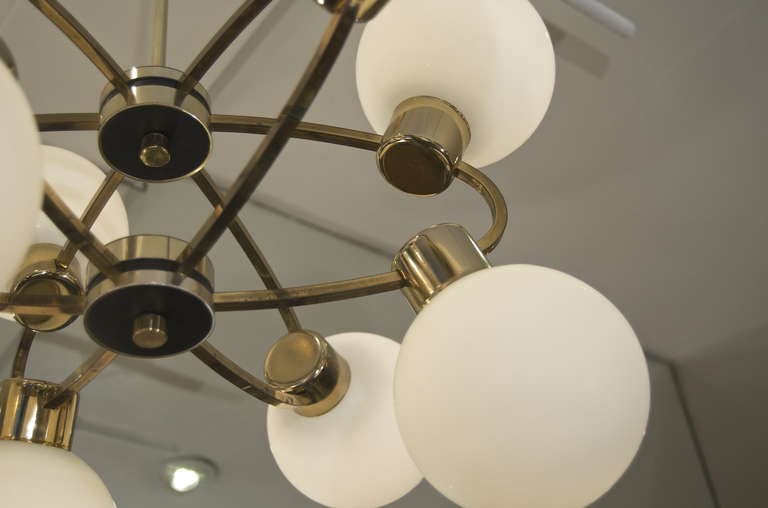Orbital Brass Chandelier with Nine Opal Glass Globes at 1stDibs