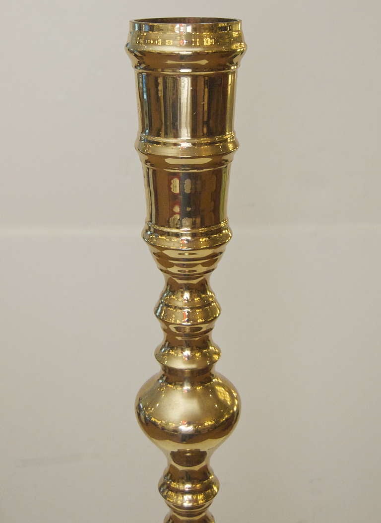 Hollywood Regency Pair of Grand Scale Brass Standing Candleholders For Sale