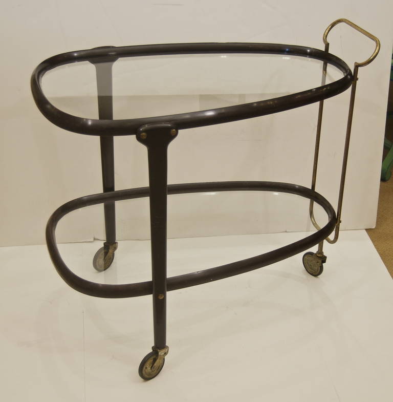 A two-tiered Italian bent wood bar cart, the three-wheeled cart running smoothly and with excellent proportions.