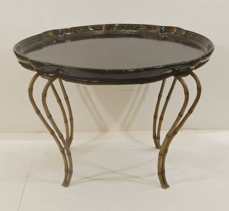 A Regency style lacquered papier mache tray top coffee table with Greek key border supported on faux bamboo bronze legs circa 1960.