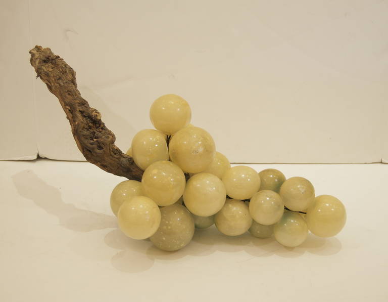 Mid-Century Modern grapes in a unique cream hue. Hard to find large size and coloration with wooden stem. A perfect centerpiece.