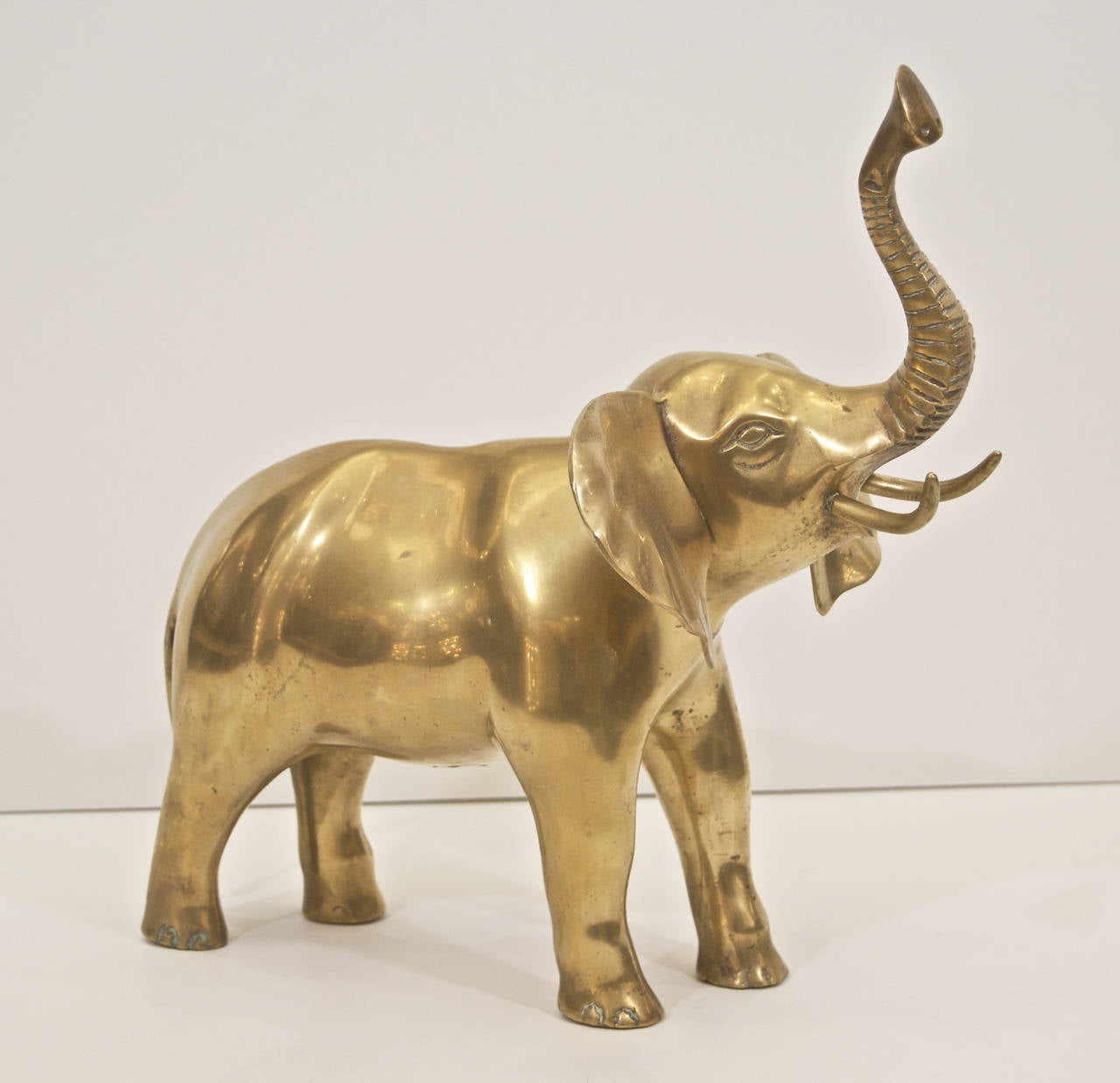 Substantial decorative sculpture in brass of a roaring elephant. Well proportioned and a charming piece.

Image is representative of piece, multiple available. Please inquire for detail images of current stock.