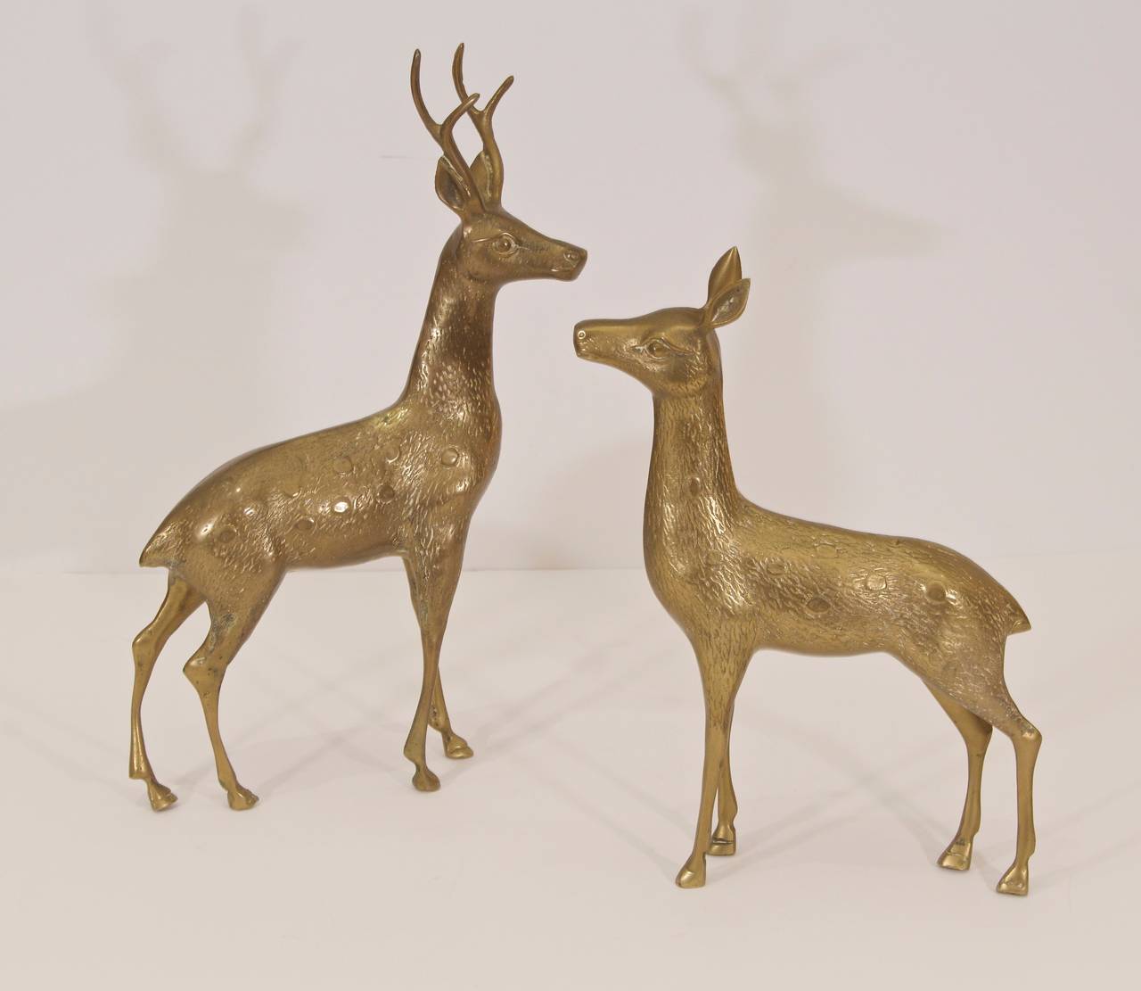 Generously sized pair of elegant reindeer in brass.

Dimensions listed are of larger, male deer.