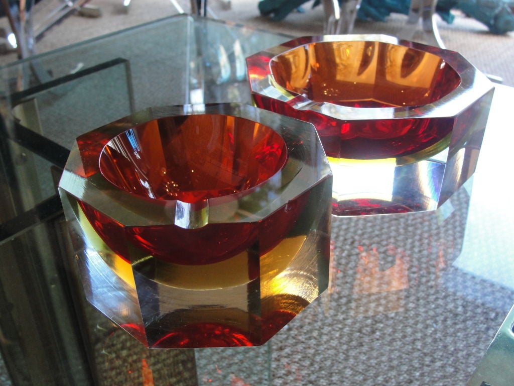 Vibrant orange, yellow and clear glass - exceptional duo of ashtrays but serve as beautiful coffee table bowls.<br />
<br />
Dimensions of smaller bowl: 2.5 inches tall, diameter 4 5/8 inches.  Priced separately.  Small Bowl $300, Large bowl