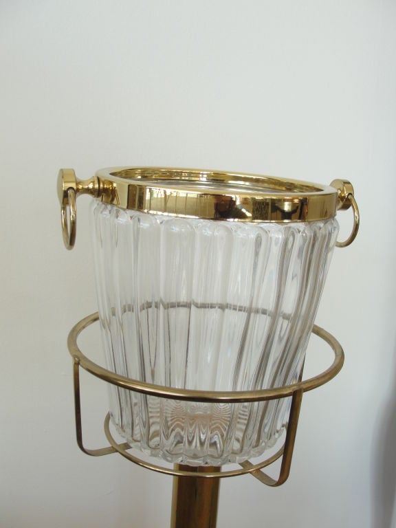 The Ice bucket alone is 8 inches in diameter and 9 inches tall.  With the stand, total height is 32 inches.  The bucket is removeable from the brass stand.
