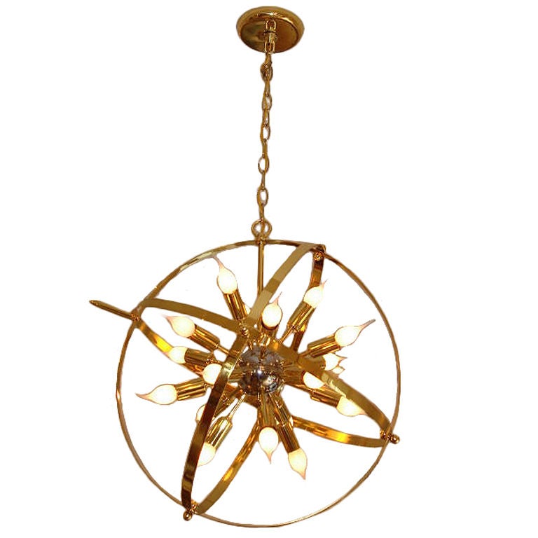 There is so much to love about this fixture, 18 lights surrounded by spheres forming a globe design.  Brass is beautiful and in wonderful condition.