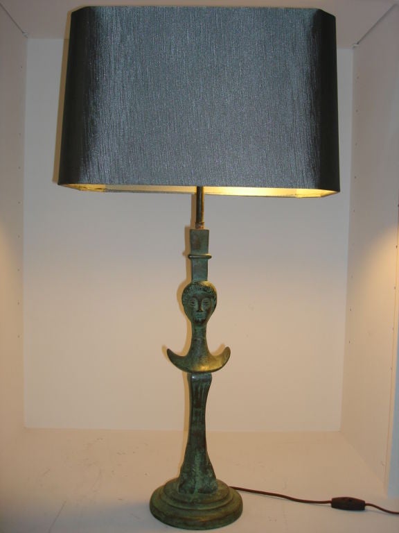 These vintage pair of bronze cast lamps from the 1960s after Giacometti's La Femme design. Shades are NOT included.