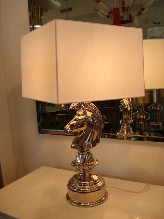 Phenomenal Knight Chess piece table lamps in shiny nickel plate over brass.  Heavy and perfectly restored.  White fabric shades Included.