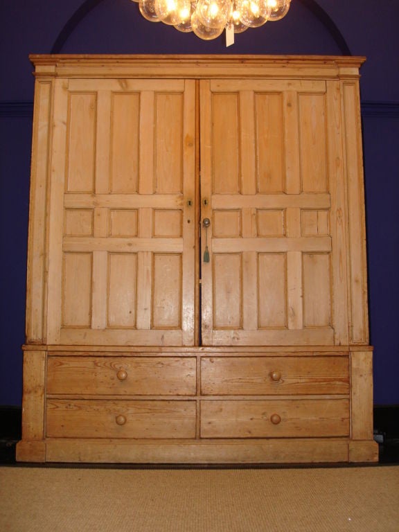 These very large and beautifully weathered antique armoire is in two sections (doors above and drawers below).<br />
<br />
Four ample drawers at base and wide doors that open to shelving for stereo equipment, etc.