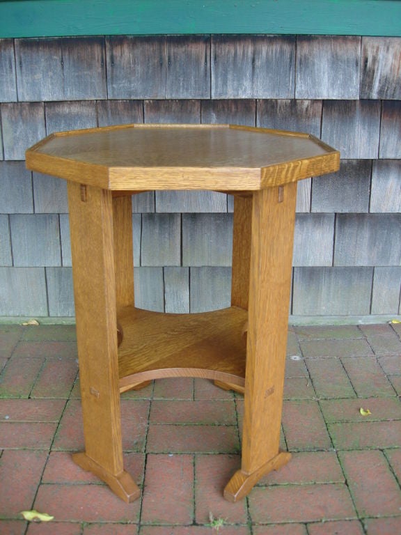 Well preserved octagonal tray top side table by Gustav Stickley with two-tiers and original stamp and label to underside.