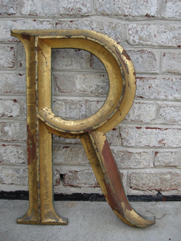 Mountable to wall and with amazing patina, this gilded letter R is a wonderful architectural element.