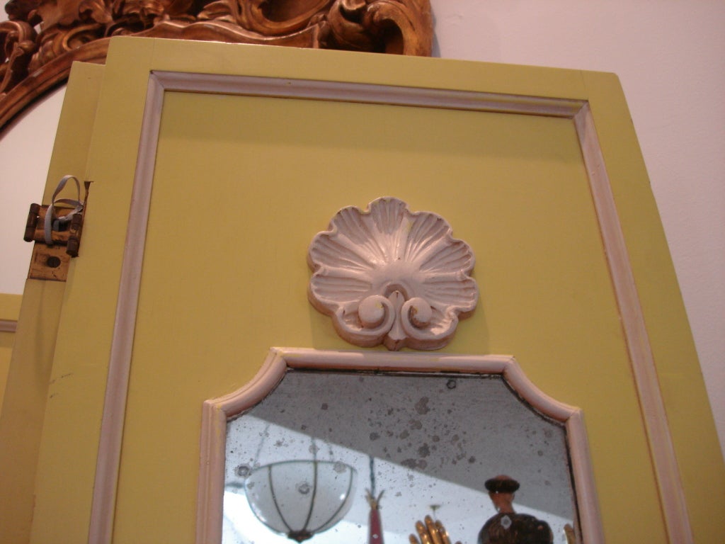 An amazing Citron painted screen with delicate white trim throoughout and vintage 1940's mirrored panels.  Seashell flourishes to top of each panel.
